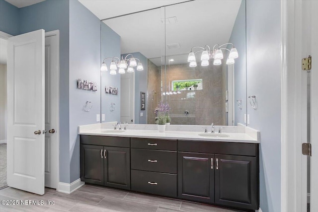 150 Calumet Dr, Saint Johns, FL 32259 - bathroom featuring double vanity, a tile shower, and wood finished floors