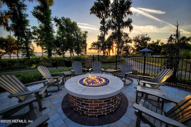 150 Calumet Dr, Saint Johns, FL 32259 - patio terrace at dusk featuring an outdoor fire pit and a patio area