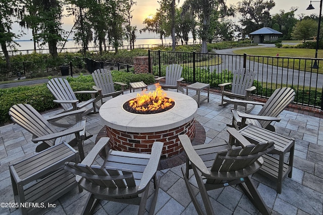 150 Calumet Dr, Saint Johns, FL 32259 - patio terrace at dusk featuring an outdoor fire pit and a patio area