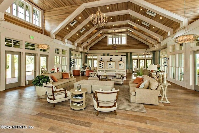 150 Calumet Dr, Saint Johns, FL 32259 - living room featuring high vaulted ceiling, healthy amount of natural light, a chandelier, wood finished floors, and recessed lighting