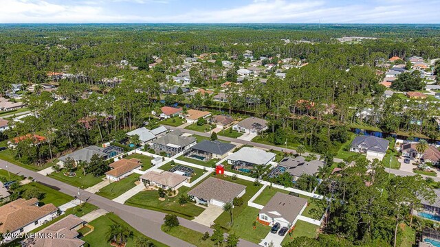 20 Evansville Ln, Palm Coast, FL 32164 - aerial overview of property's location featuring nearby suburban area and a forest