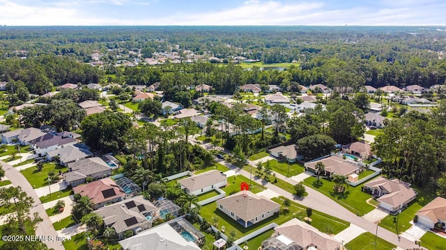 20 Evansville Ln, Palm Coast, FL 32164 - aerial overview of property's location with a heavily wooded area and nearby suburban area