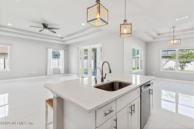 20 Evansville Ln, Palm Coast, FL 32164 - kitchen with a tray ceiling, light tile patterned flooring, dishwasher, open floor plan, and recessed lighting