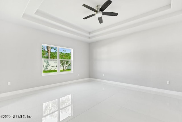 20 Evansville Ln, Palm Coast, FL 32164 - tiled empty room featuring a raised ceiling and ceiling fan