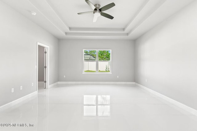 20 Evansville Ln, Palm Coast, FL 32164 - unfurnished room featuring a tray ceiling, ceiling fan, light tile patterned floors, and a smoke detector
