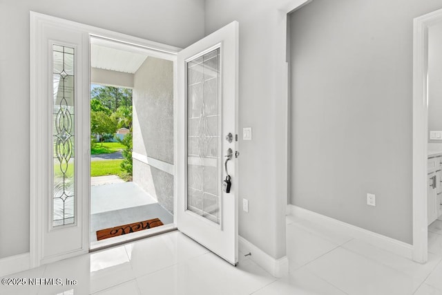 20 Evansville Ln, Palm Coast, FL 32164 - tiled entryway featuring baseboards