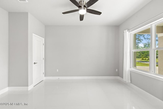 20 Evansville Ln, Palm Coast, FL 32164 - empty room with ceiling fan and tile patterned floors
