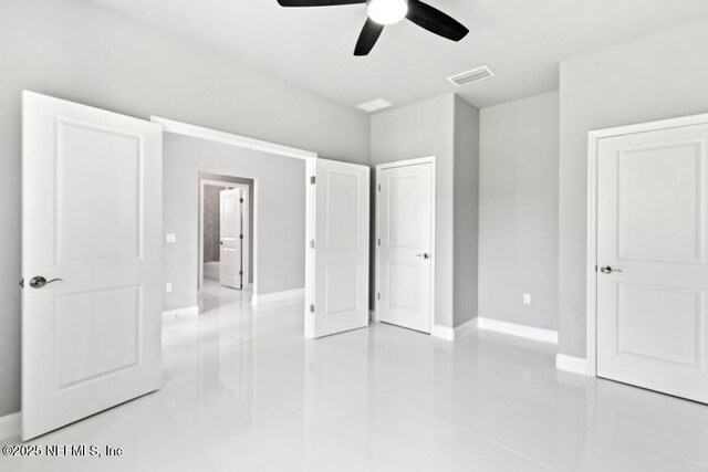 20 Evansville Ln, Palm Coast, FL 32164 - unfurnished bedroom featuring light tile patterned floors and a ceiling fan