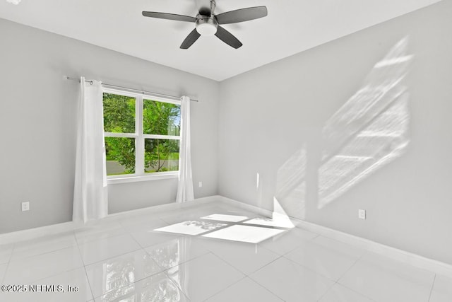 20 Evansville Ln, Palm Coast, FL 32164 - tiled spare room featuring baseboards and a ceiling fan