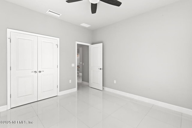 20 Evansville Ln, Palm Coast, FL 32164 - unfurnished bedroom featuring a closet, ceiling fan, and light tile patterned floors