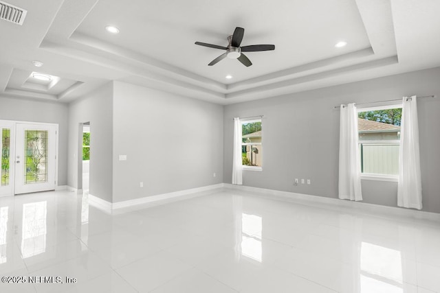 20 Evansville Ln, Palm Coast, FL 32164 - tiled empty room featuring a raised ceiling, ceiling fan, and recessed lighting