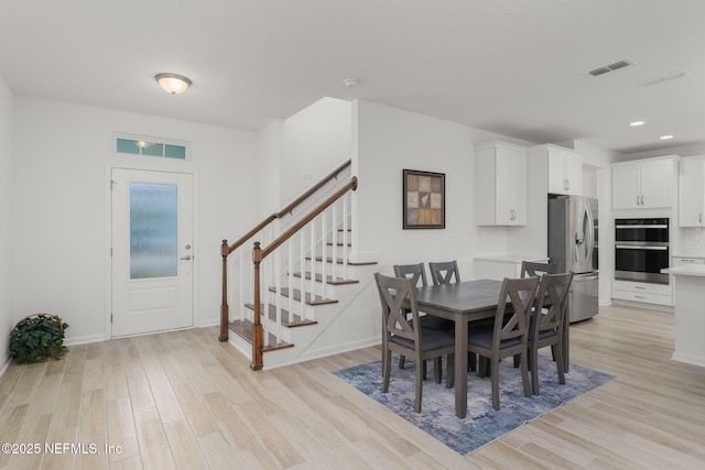 174 Torres Trce, Saint Augustine, FL 32095 - dining space featuring light wood finished floors, stairway, and recessed lighting