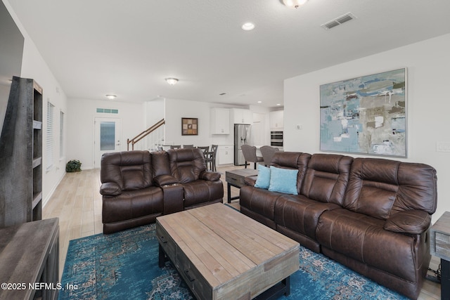 174 Torres Trce, Saint Augustine, FL 32095 - living room featuring light wood-style flooring, stairs, and recessed lighting