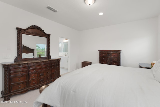 174 Torres Trce, Saint Augustine, FL 32095 - bedroom with light colored carpet, connected bathroom, and recessed lighting