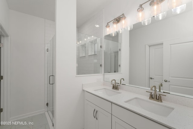 174 Torres Trce, Saint Augustine, FL 32095 - bathroom featuring double vanity, a stall shower, and marble look tiles
