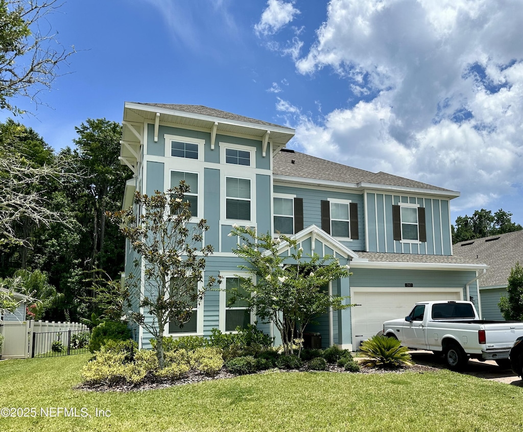 217 Latrobe Ave, Saint Augustine, FL 32095 - view of front of home with a garage and a shingled roof