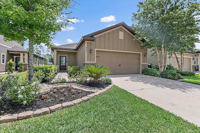 235 Brybar Dr, Saint Augustine, FL 32095 - view of front of property with board and batten siding, a garage, concrete driveway, and a front lawn