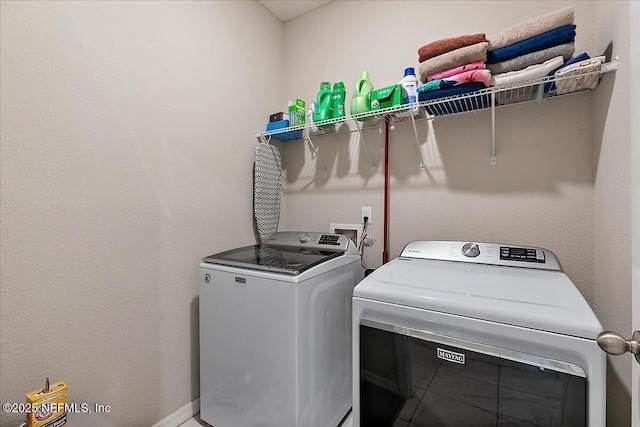 235 Brybar Dr, Saint Augustine, FL 32095 - laundry room featuring washing machine and dryer and baseboards