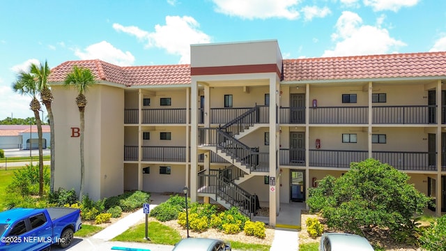 4250 A1A Unit B16, Saint Augustine, FL 32080 - view of building exterior with stairs and uncovered parking