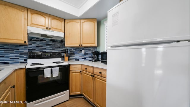 4250 A1A Unit B16, Saint Augustine, FL 32080 - kitchen featuring freestanding refrigerator, electric range, under cabinet range hood, and light countertops