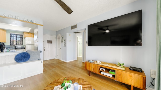 4250 A1A Unit B16, Saint Augustine, FL 32080 - living area with a ceiling fan and light wood-style flooring