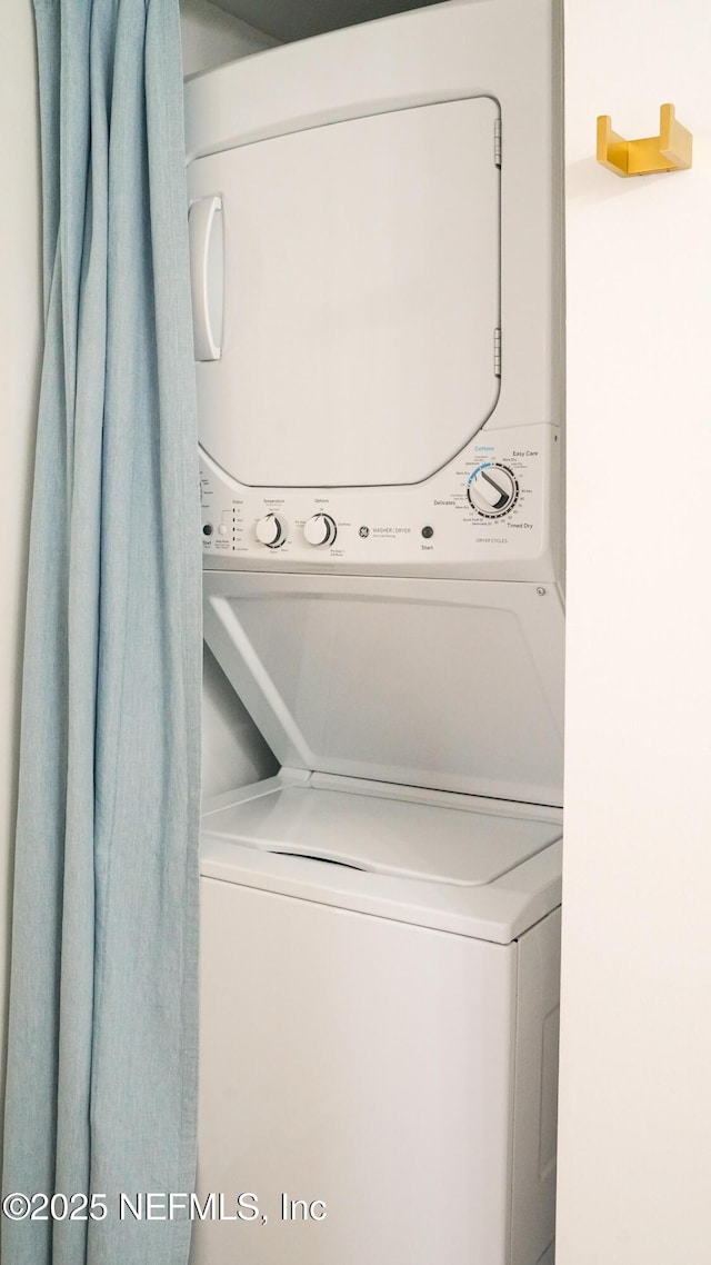 4250 A1A Unit B16, Saint Augustine, FL 32080 - laundry area featuring stacked washer / dryer
