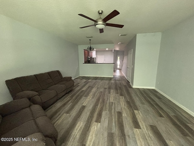 6967 Roundleaf Dr, Jacksonville, FL 32258 - living area featuring a ceiling fan and dark wood-style flooring