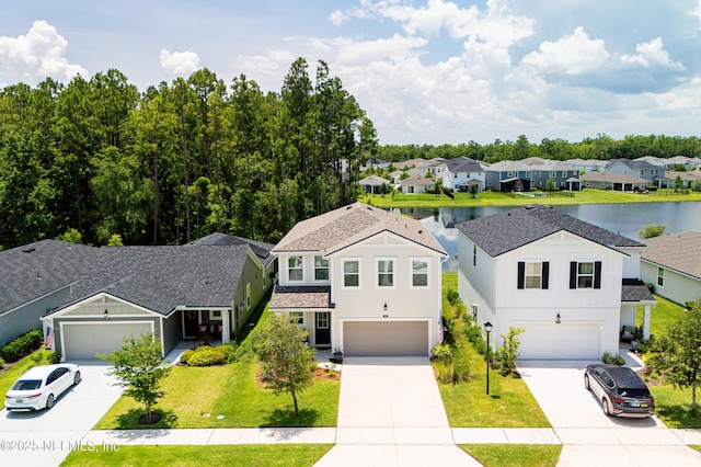 105 Meadow Creek Dr, Saint Johns, FL 32259 - view of front of house with concrete driveway, a residential view, a water view, a front lawn, and an attached garage