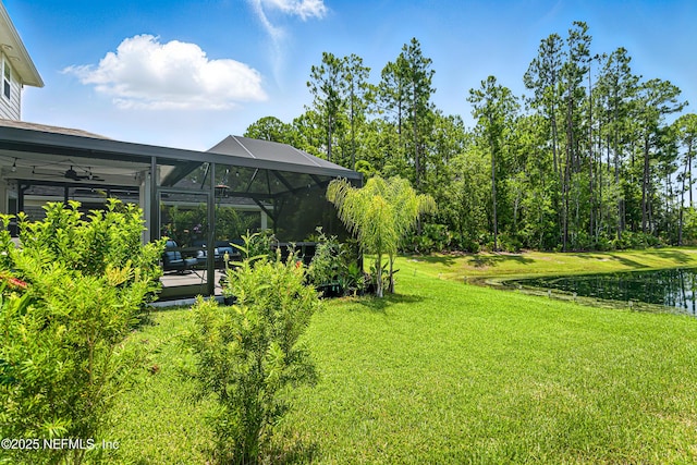 105 Meadow Creek Dr, Saint Johns, FL 32259 - view of green lawn with a water view, a lanai, a ceiling fan, and a patio area