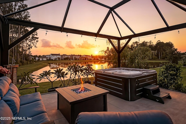 105 Meadow Creek Dr, Saint Johns, FL 32259 - patio terrace at dusk with a hot tub, a fire pit, a patio, a water view, and a gazebo