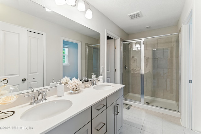 105 Meadow Creek Dr, Saint Johns, FL 32259 - full bath with tile patterned flooring, double vanity, and a stall shower