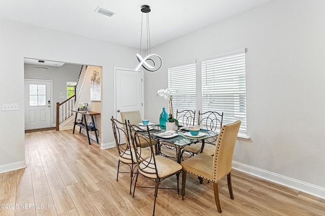 105 Meadow Creek Dr, Saint Johns, FL 32259 - dining area with light wood finished floors and stairway