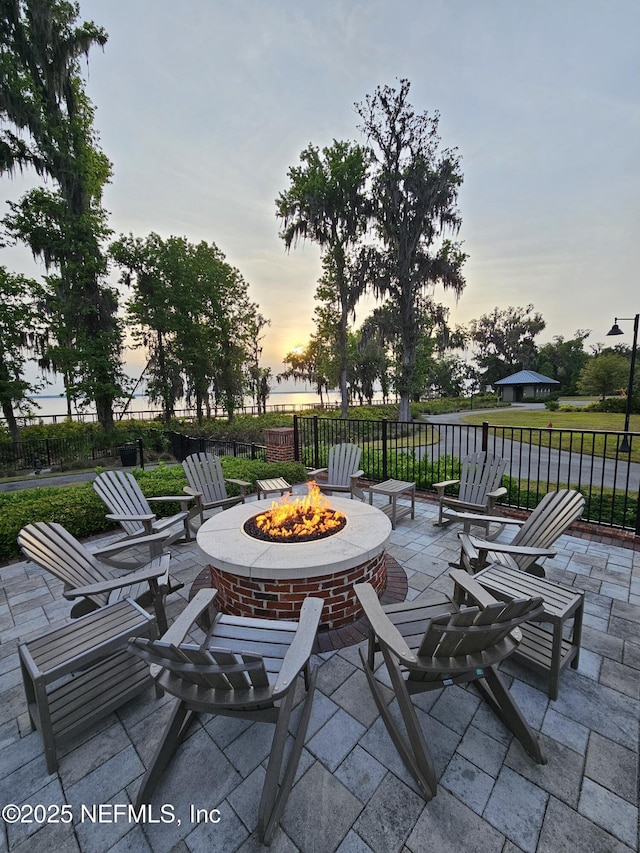 105 Meadow Creek Dr, Saint Johns, FL 32259 - patio terrace at dusk with a fire pit and a patio area