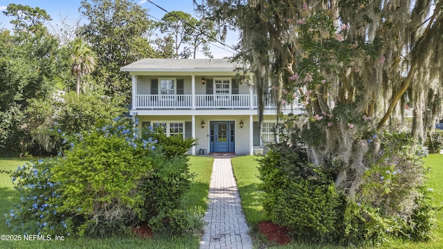 3679 Rustic Ln, Jacksonville, FL 32217 - view of front of house featuring a front lawn and a balcony