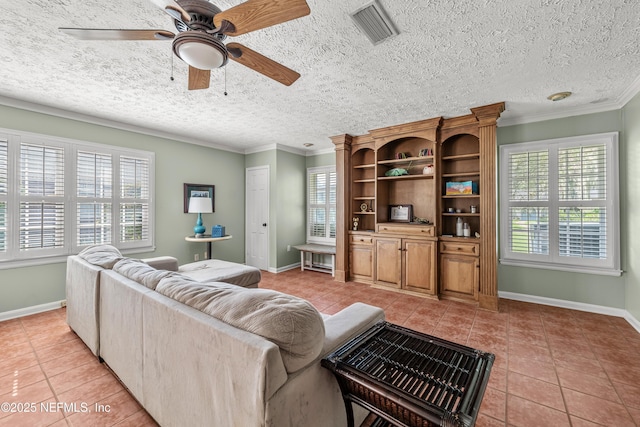 3679 Rustic Ln, Jacksonville, FL 32217 - living area with light tile patterned flooring, ceiling fan, plenty of natural light, crown molding, and a textured ceiling