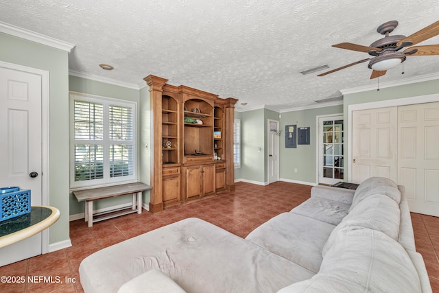 3679 Rustic Ln, Jacksonville, FL 32217 - living area featuring ceiling fan, tile patterned floors, crown molding, and electric panel