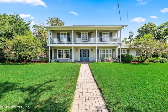 3679 Rustic Ln, Jacksonville, FL 32217 - view of front of property with a front yard, covered porch, and a balcony