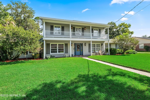 3679 Rustic Ln, Jacksonville, FL 32217 - view of front of property featuring a balcony, a front lawn, and a porch