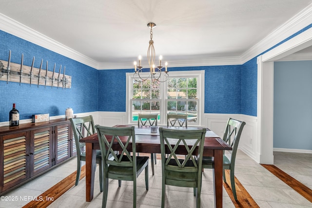 3679 Rustic Ln, Jacksonville, FL 32217 - dining room with a chandelier, wainscoting, and ornamental molding