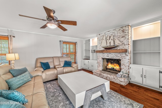 3679 Rustic Ln, Jacksonville, FL 32217 - living room featuring wood finished floors, crown molding, ceiling fan, a fireplace, and built in shelves