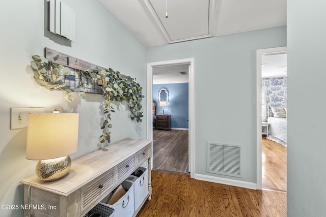 3679 Rustic Ln, Jacksonville, FL 32217 - hall with attic access and wood finished floors