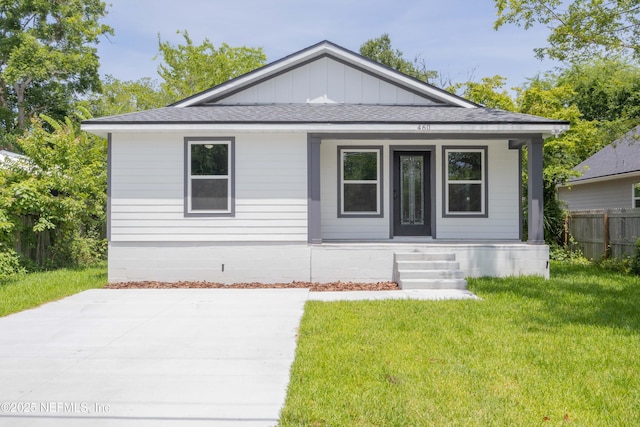 460 S Nassau St, Saint Augustine, FL 32084 - view of front of house with covered porch, roof with shingles, and board and batten siding