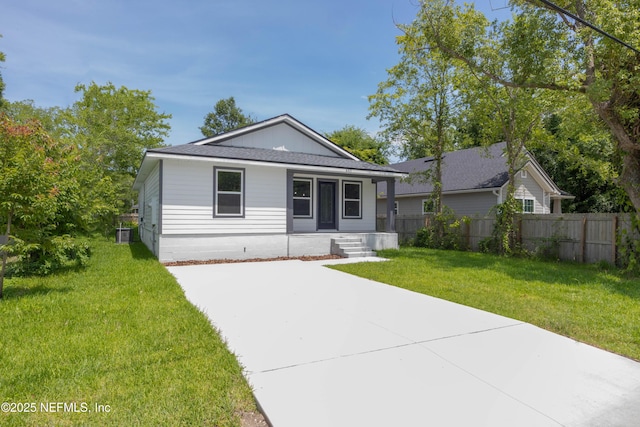 460 S Nassau St, Saint Augustine, FL 32084 - view of front of house with covered porch, driveway, and roof with shingles