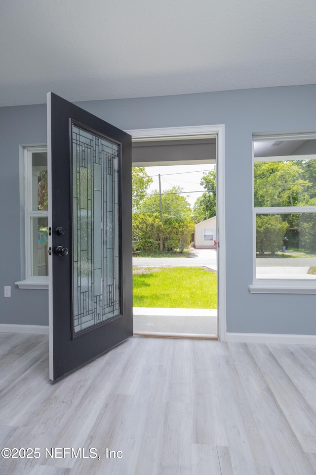 460 S Nassau St, Saint Augustine, FL 32084 - entryway featuring baseboards and wood finished floors