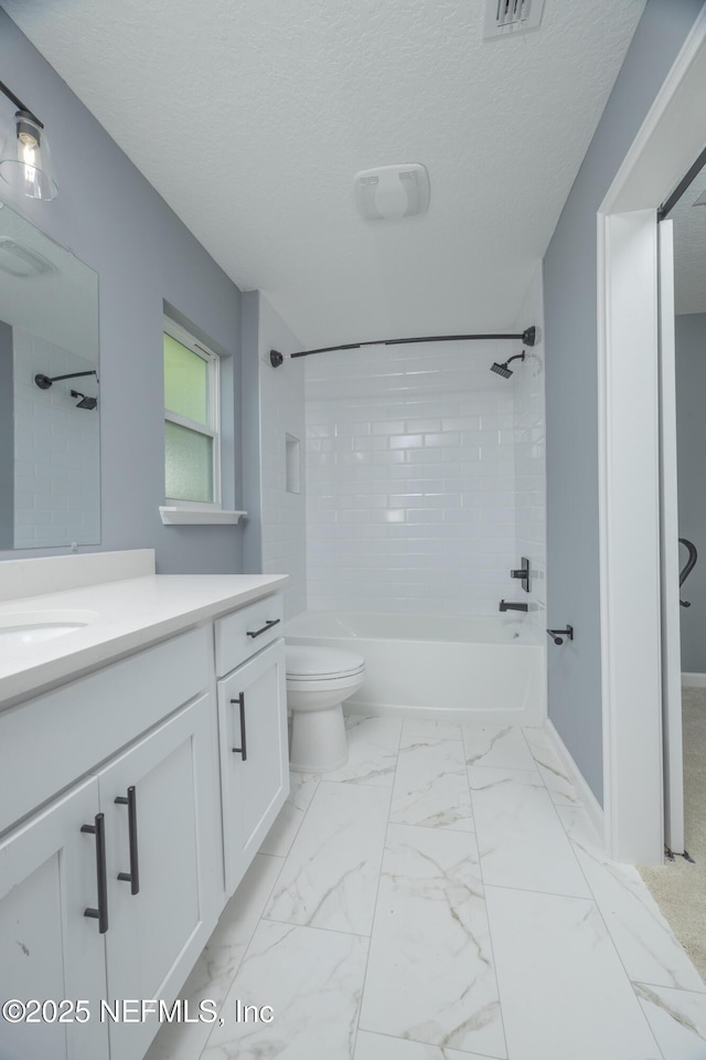 460 S Nassau St, Saint Augustine, FL 32084 - full bath featuring vanity, washtub / shower combination, marble finish floors, and a textured ceiling