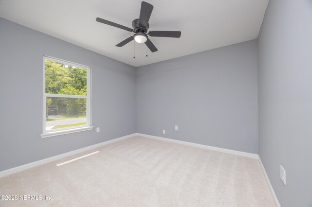 460 S Nassau St, Saint Augustine, FL 32084 - carpeted empty room with baseboards and ceiling fan