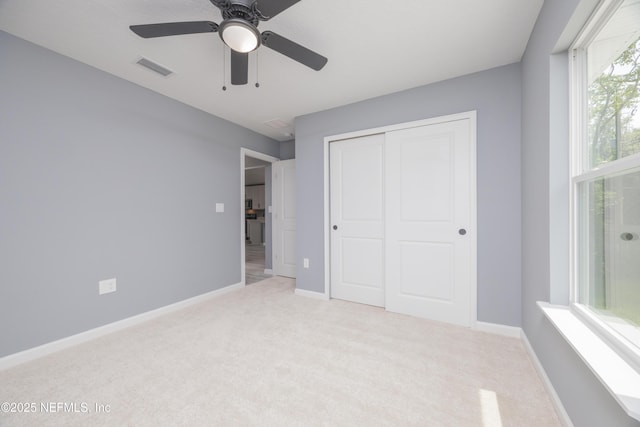 460 S Nassau St, Saint Augustine, FL 32084 - unfurnished bedroom with carpet flooring, a closet, and ceiling fan