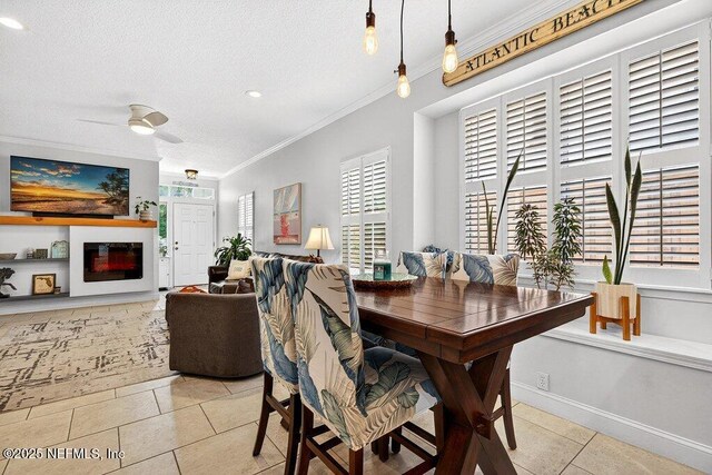 611 Selva Lakes Cir, Atlantic Beach, FL 32233 - dining area with crown molding, light tile patterned floors, a textured ceiling, and a ceiling fan