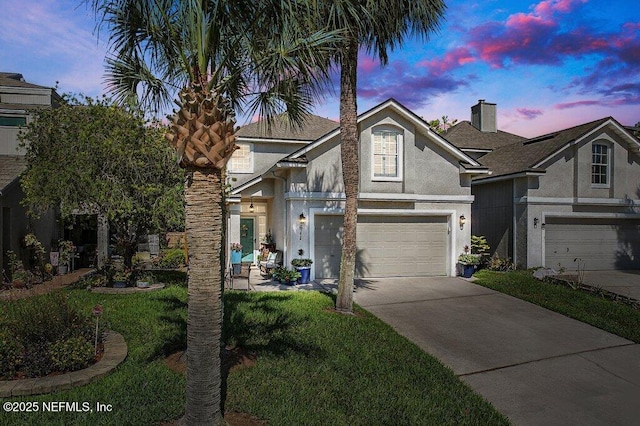 611 Selva Lakes Cir, Atlantic Beach, FL 32233 - view of front of home featuring stucco siding, concrete driveway, and a garage
