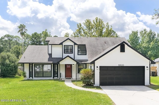 8820 Bandera Cir S, Jacksonville, FL 32244 - traditional-style house featuring an attached garage, a front lawn, driveway, and a shingled roof